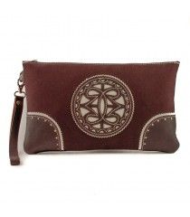Bolso de mano de tela con adornos en piel.