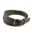 Bullfighting belt of leather and cattle ranching irons in fuchsia.